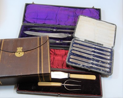 Lot 283 - A cased carving set with antler handles and...