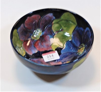 Lot 214 - A Moorcroft pottery bowl, the deep blue ground...