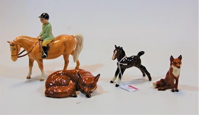 Lot 217 - A Beswick figure of a boy on pony, model...
