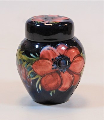 Lot 224 - A small Moorcroft jar and cover, on a deep...