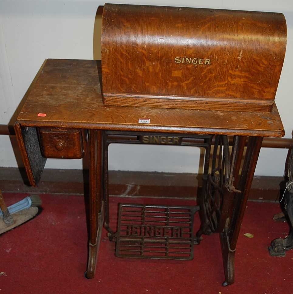 Lot 1181 - An early 20th century Singer treadle sewing...