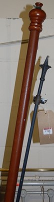Lot 1204 - A contemporary turned beech curtain rail, with...