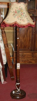 Lot 1213 - A 1930s turned walnut standard lamp, with...