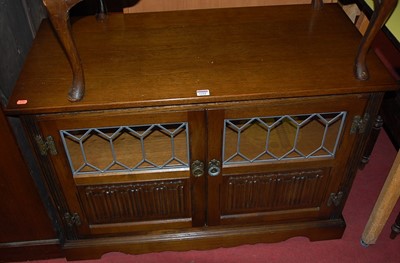 Lot 1222 - A contemporary Old Charm linenfold moulded oak...