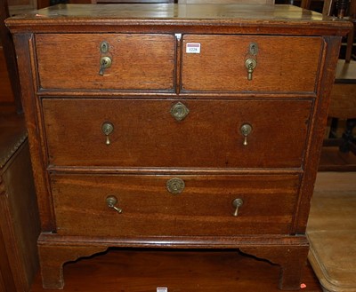 Lot 1228 - An antique oak and mahogany low chest of two...