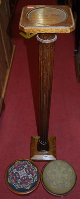 Lot 1237 - A fluted oak pedestal plant stand; together...