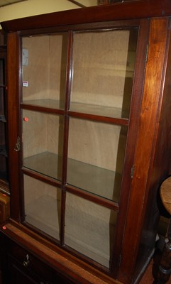 Lot 1245 - A 19th century mahogany single door glazed...