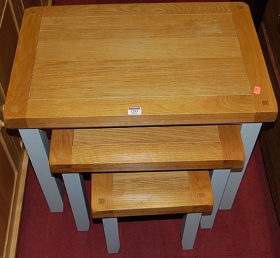 Lot 1253 - A contemporary light oak and grey painted nest...