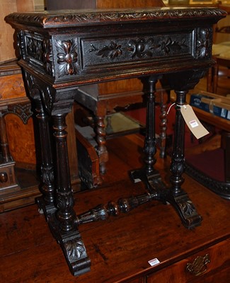 Lot 1260 - A circa 1900 ebonised and relief carved oak...