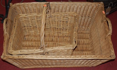 Lot 1265 - A large wicker twin handled carrying basket,...