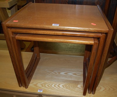 Lot 1281 - A 1970s G-Plan teak nest of three occasional...
