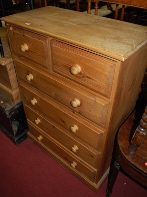 Lot 1288 - A modern pine square front chest of two short...