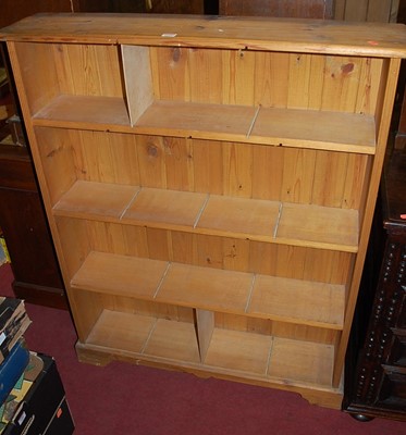 Lot 1293 - A modern pine round cornered open bookshelf,...