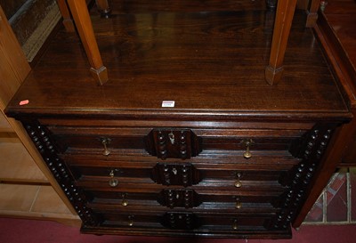 Lot 1295 - An 18th century oak chest of four long drawers,...