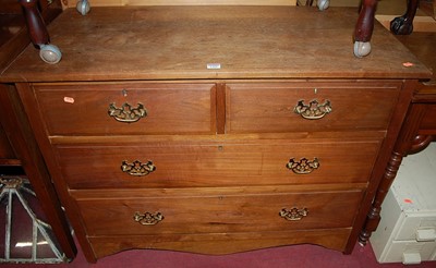 Lot 1300 - An Edwardian walnut chest of two short over...