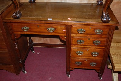 Lot 1302 - An Edwardian walnut single pedestal kneehole...