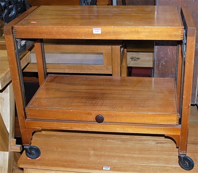 Lot 1307 - An Art Deco walnut two-tier tea trolley, with...