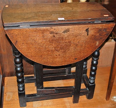 Lot 1314 - A small 19th century oak drop-leaf occasional...