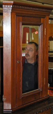 Lot 1318 - An Edwardian walnut single mirrored door...