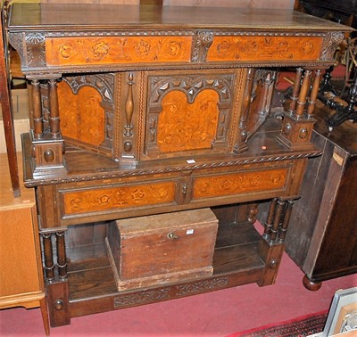 Lot 1319 - An unusual Continental antique oak and floral...