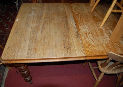 Lot 1324 - A late Victorian oak extending dining table,...