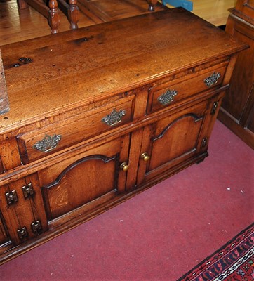 Lot 1354 - A large contemporary joined oak long sideboard,...