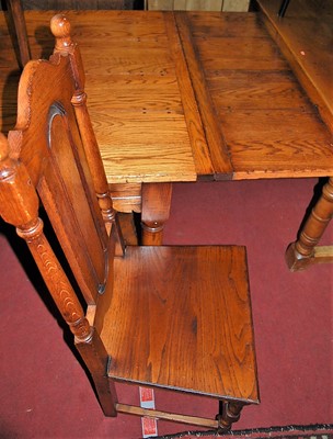 Lot 1363 - A contemporary joined oak dining suite in the...