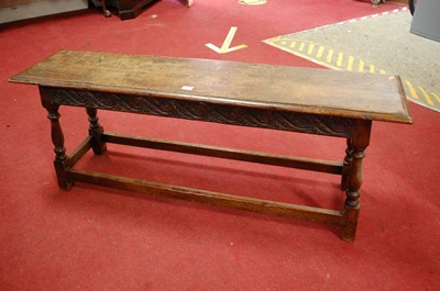 Lot 1367 - A joined and floral relief carved oak long...