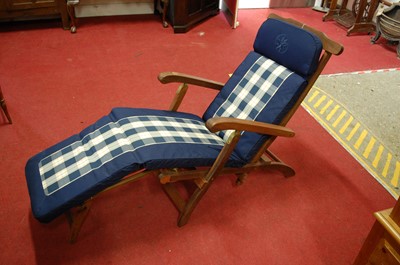 Lot 1368 - A contemporary teak slatted folding steamer...