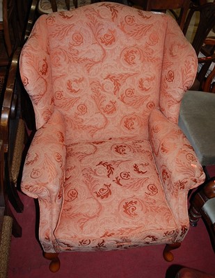 Lot 1407 - A contemporary red floral upholstered wingback...