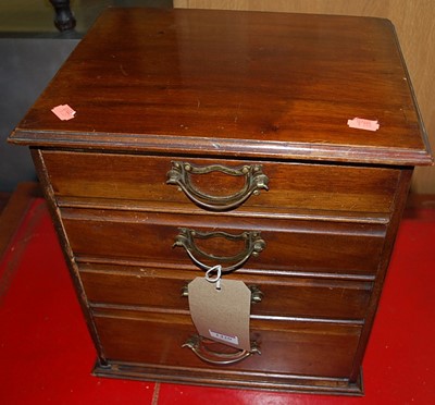 Lot 1420 - An Edwardian mahogany table top chest of four...