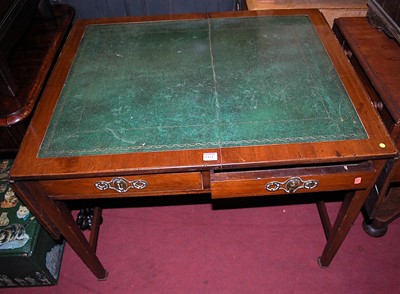 Lot 1424 - A 19th century mahogany and gilt tooled green...