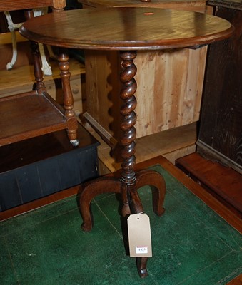 Lot 1425 - An early 20th century oak circular fixed top...