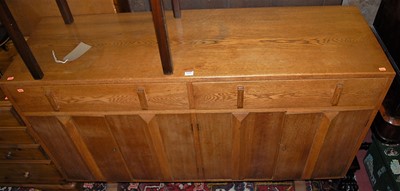 Lot 1430 - An Art Deco oak sideboard, fitted with twin...