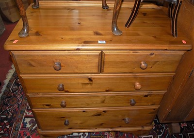 Lot 1433 - A modern pine round cornered chest of two...