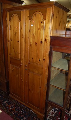 Lot 1437 - A modern pine double door wardrobe, width 100cm