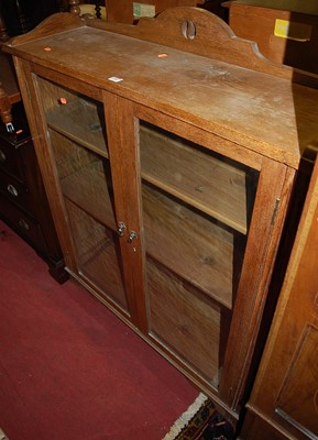 Lot 1440 - A 1930s oak three-quarter gallery backed...