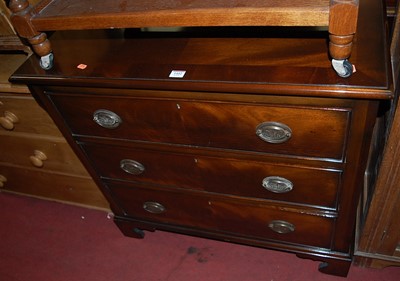 Lot 1442 - A reproduction mahogany chest of three long...