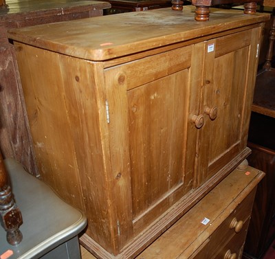 Lot 1444 - A rustic pine low double door side cupboard,...