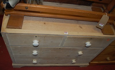 Lot 1456 - A Victorian limed pine low chest of two short...