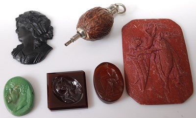 Lot 378 - A collection of carved hardstone intaglios...