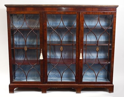 Lot 1518 - A mahogany glazed bookcase, in the late...