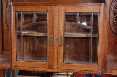 Lot 291 - An Arts & Crafts oak dresser, the upper...