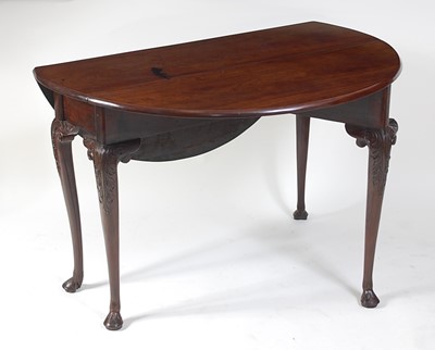 Lot 1499 - A George II red walnut gateleg dining table,...