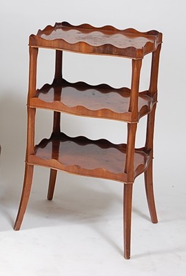 Lot 1576 - An early 20th century yew wood three-tier...