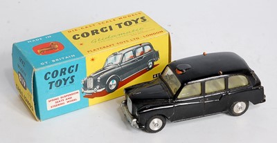 Lot 1618 - A Corgi Toys No. 418 Austin Taxi comprising of...