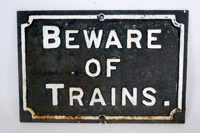Lot 9 - A original cast iron 'Beware of Trains' sign,...
