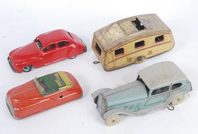 Lot 3250 - A British tinplate and clockwork mixed saloon...