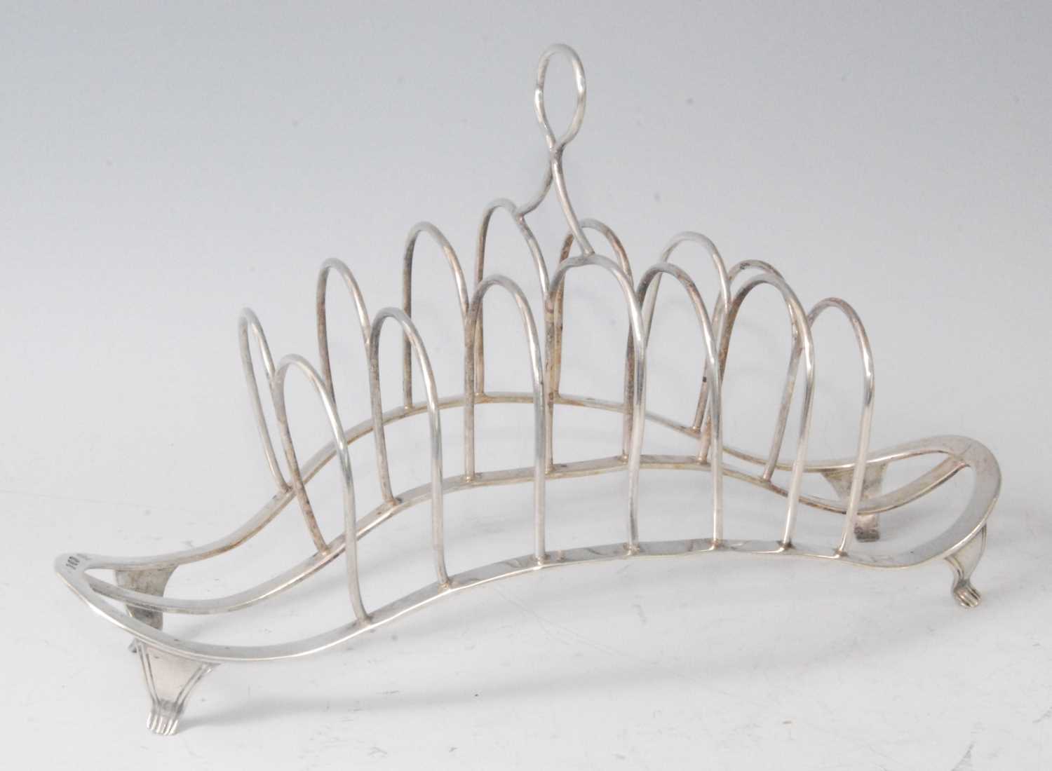 Lot 1117 - A late Victorian silver six-division toastrack,...