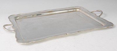 Lot 1146 - A George V silver twin handled drinks tray, of...